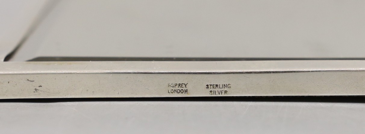 A small modern sterling mounted rectangular mirror, retailed by Asprey, London, 15.4cm.
